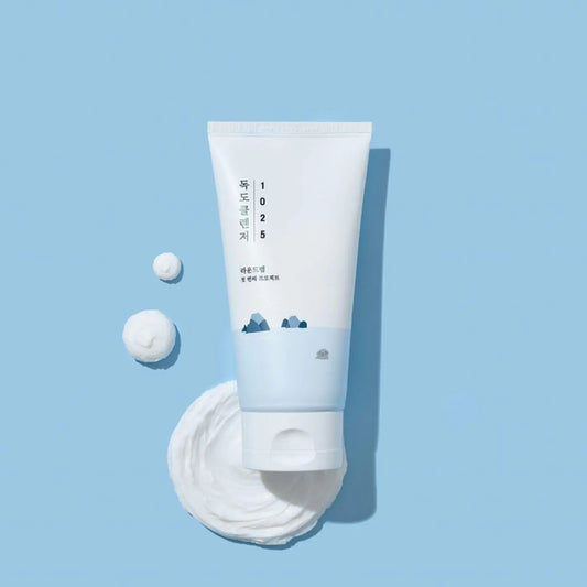 White tube of 1025 dokdo cleanser 150ml with minimalist design and blue mountain illustration from best korean skincare brands sa