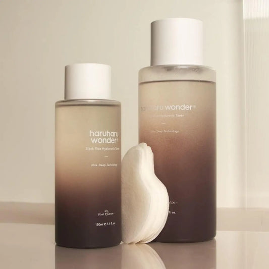 Two translucent gradient bottles of haruharu wonder black rice hydrating toner with white caps from the best korean skincare brands sa