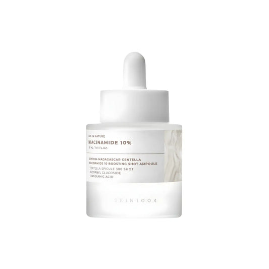 Clear glass bottle with white dropper and minimalist label featuring niacinamide 10 for madagascar centella niacinamide boosting shot ampoule