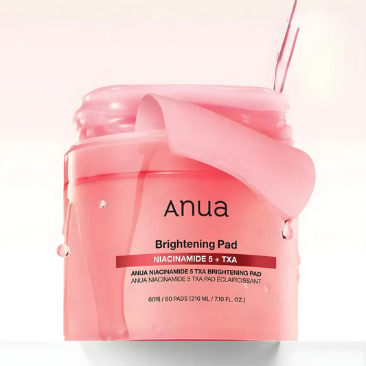 Pink translucent jar of anua niacinamide 5 txa brightening toner pads with a glossy finish and droplets for best korean skincare brands sa