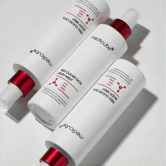 Three white cylindrical bottles with red caps labeled medicube red clear cica body mist 200ml for clear cica body care