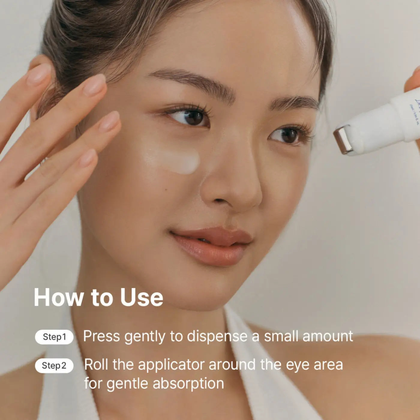 White cylindrical retinol flat iron eye roller with metallic silver tip for authentic korean skincare and cica retisome care