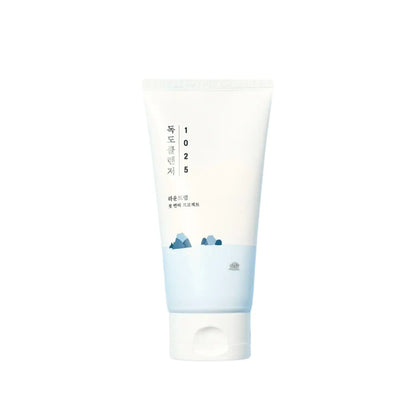 A minimalist white and light blue tube of 1025 dokdo cleanser 150ml with subtle mountain illustration from the seoul palette