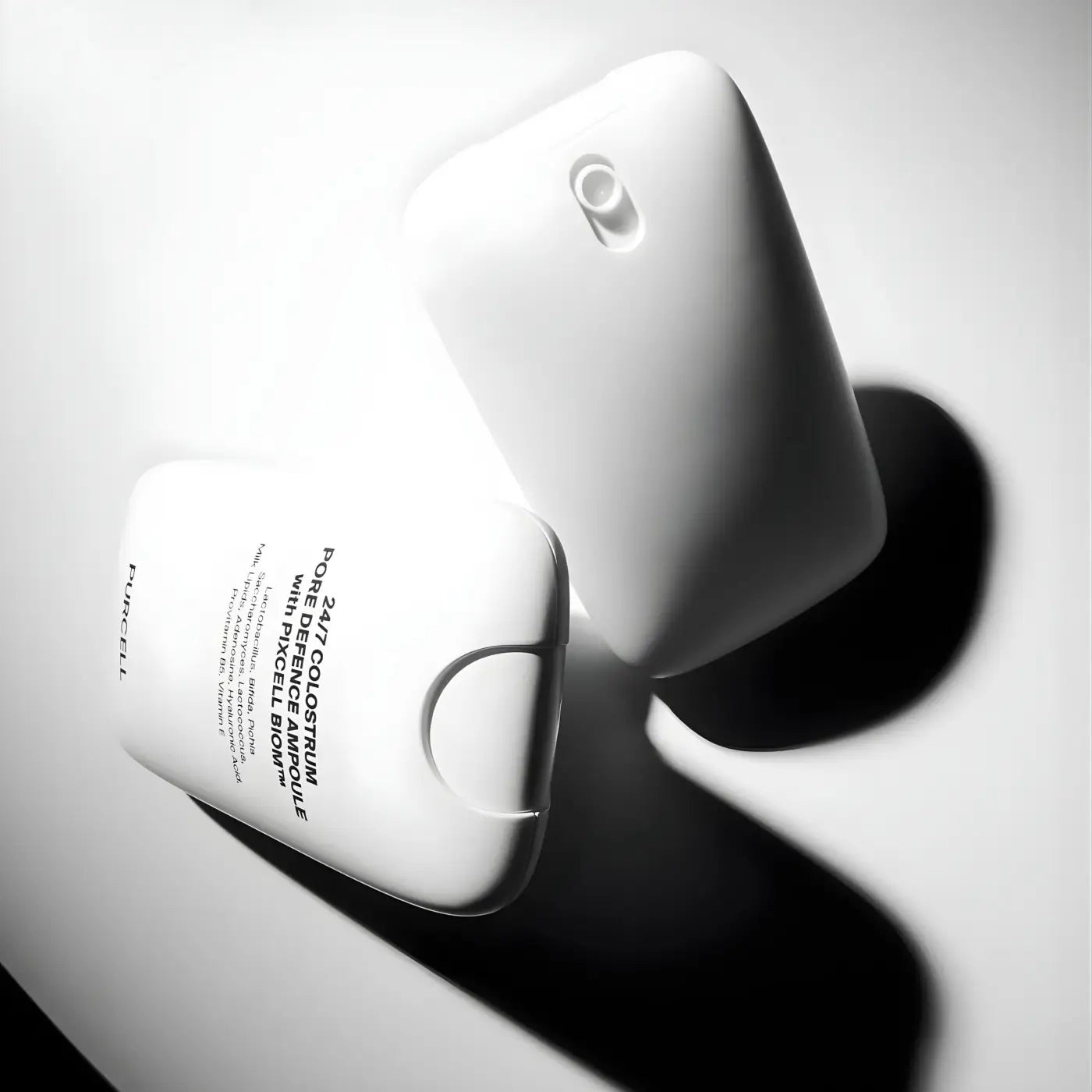 White rectangular colostrum pore defence ampoule 55ml bottle with rounded edges and pigment defective browns label
