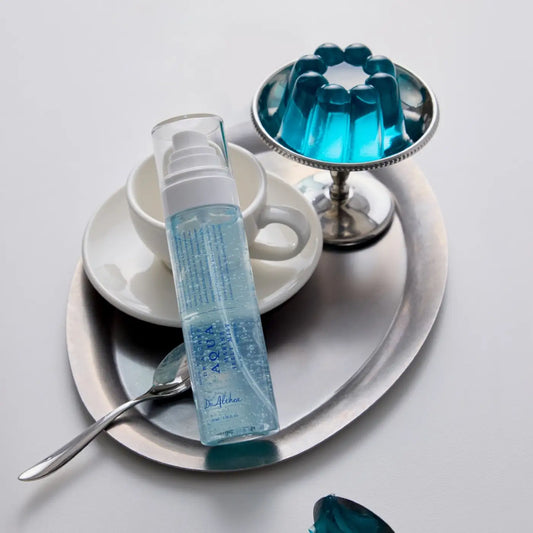 Transparent blue vegan pdrn aqua marine jelly in a clear plastic bottle with white pump dispenser by dr