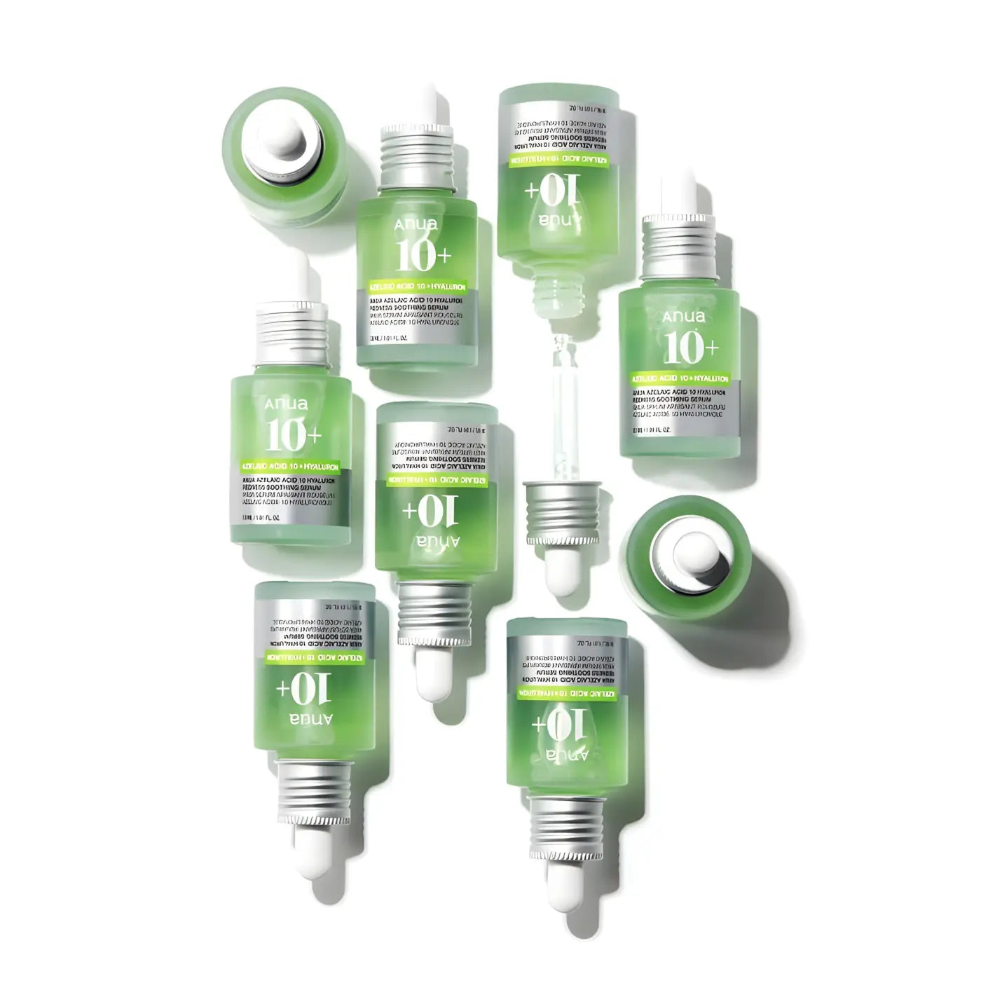 Clear glass bottles with green azelaic acid serum and silver dropper caps for Korean skincare and blemish-prone skin