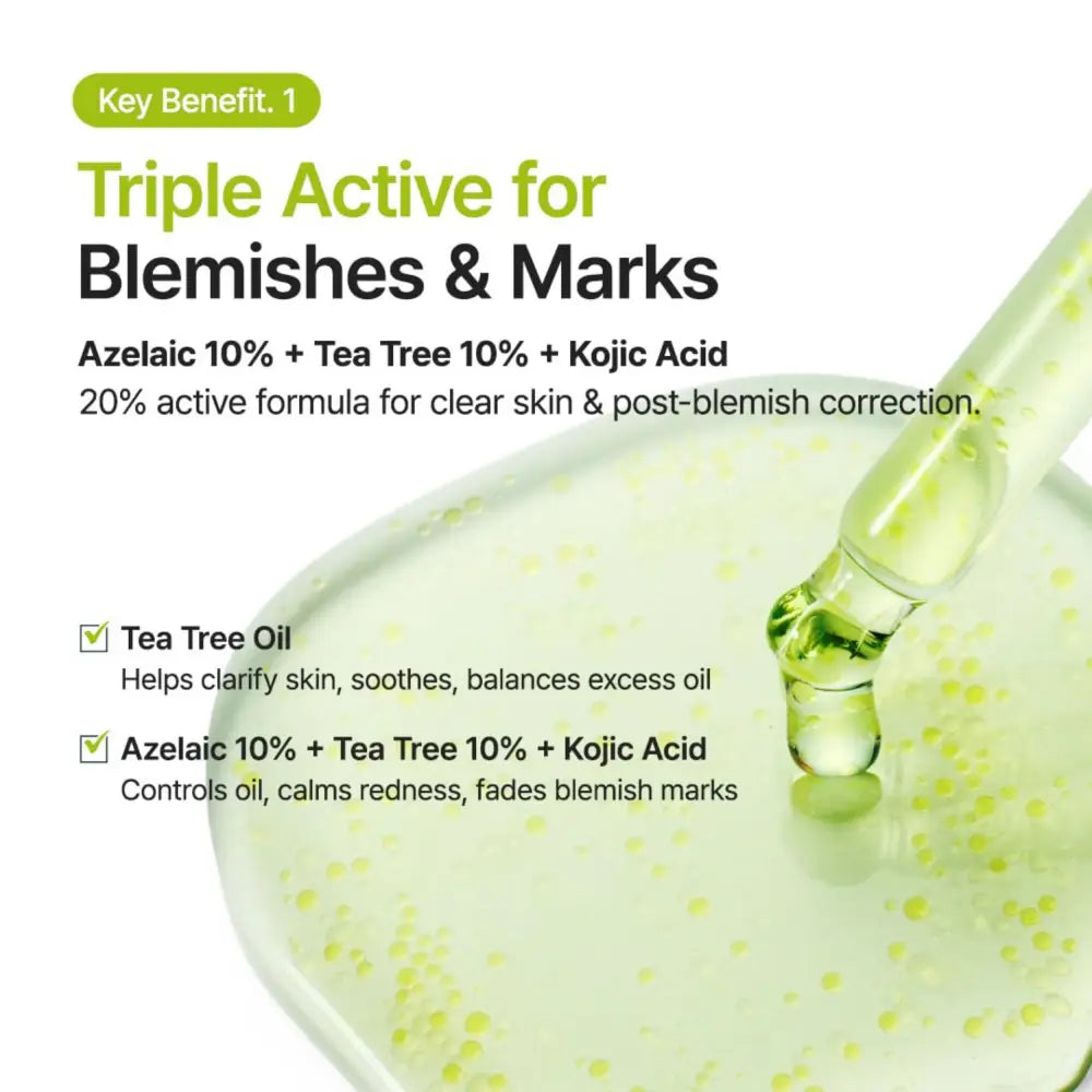 A clear glass dropper dispenses light green azelaic acid 10 kojic tea tree serum into a shallow bowl