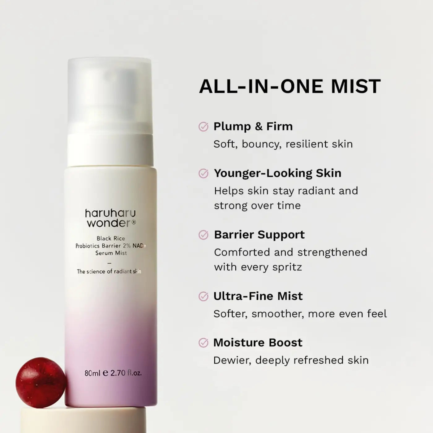 A sleek gradient-pink to white cylindrical mist bottle with frosted nozzle for black rice probiotics barrier serum