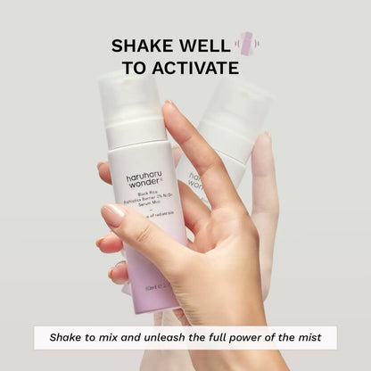 A sleek white and lavender frosted glass bottle of haruharu wonder black rice probiotics barrier serum mist with ferment filtrate