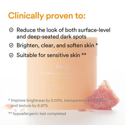A peach-colored cylindrical container of abib glutathione dark spot cream for glutathiosome dark spot treatment