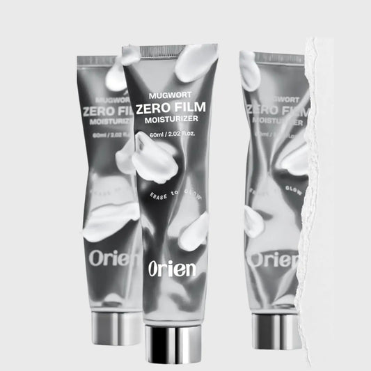 Silver metallic tube of mugwort zero film moisturizer by orien with sleek design and bold white branding 60ml