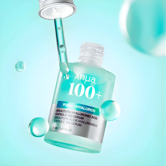 A translucent teal glass bottle of anua pdrn hyaluronic acid capsule 100 serum with a silver dropper cap and label