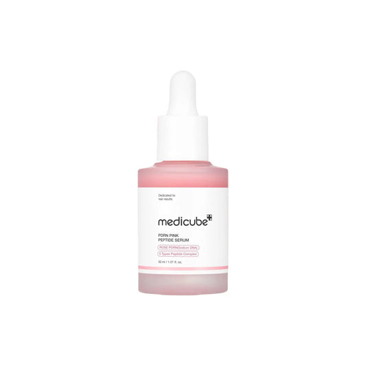 A translucent pink glass bottle with a white dropper cap labeled medicube pdrn pink peptide serum 30ml