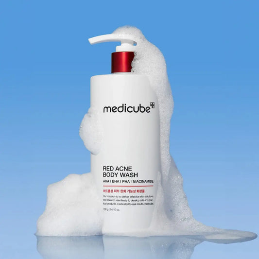 White medicube red acne body wash pump bottle with red accents and foamy texture from best korean skincare brands sa