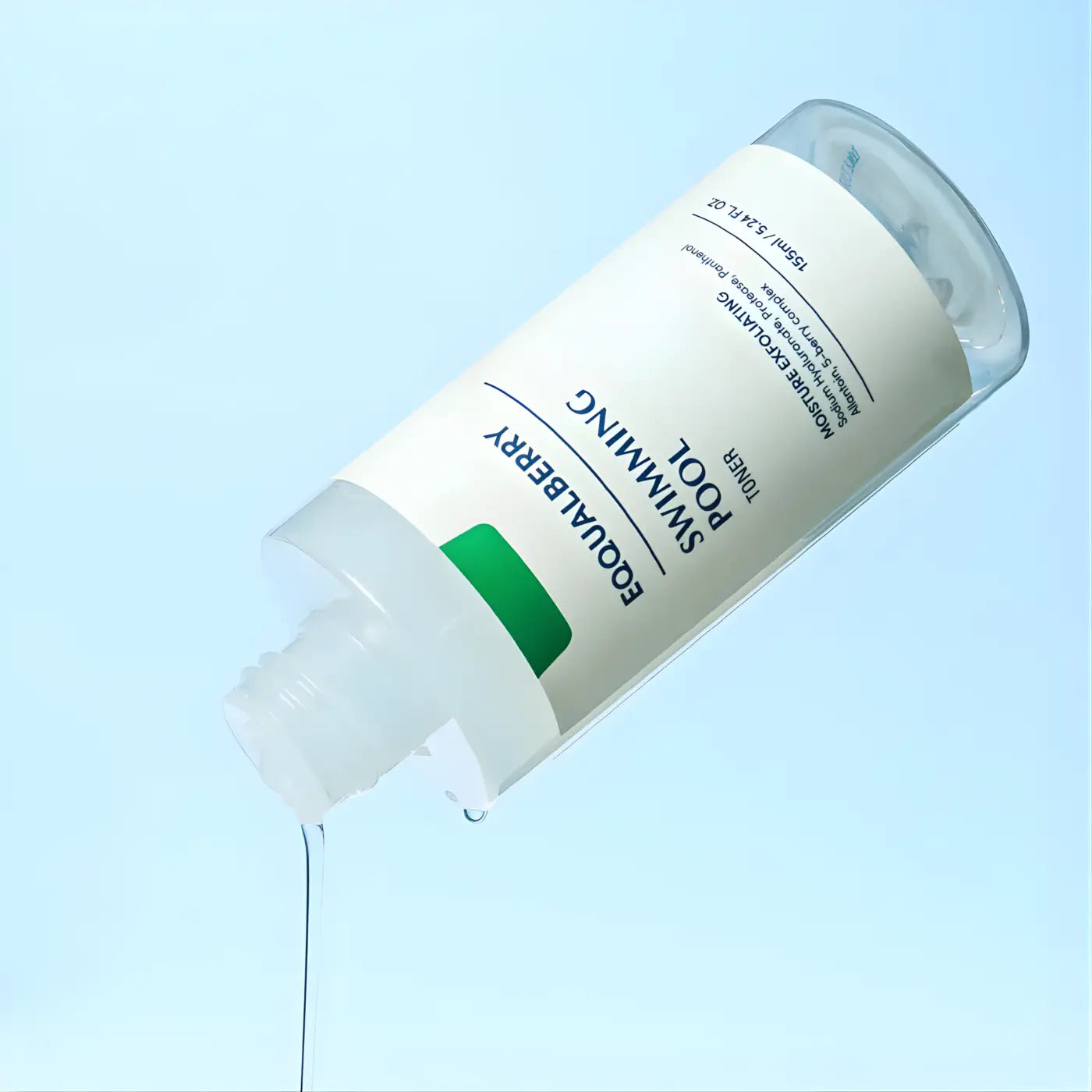 A clear glass equalberry swimming pool moisture exfoliating toner bottle with white label and green accent for skin care